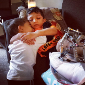 Jahan comforting his older brother, Arshaan