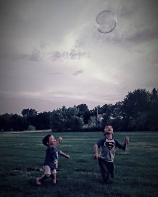 The Adam boys playing with bubbles