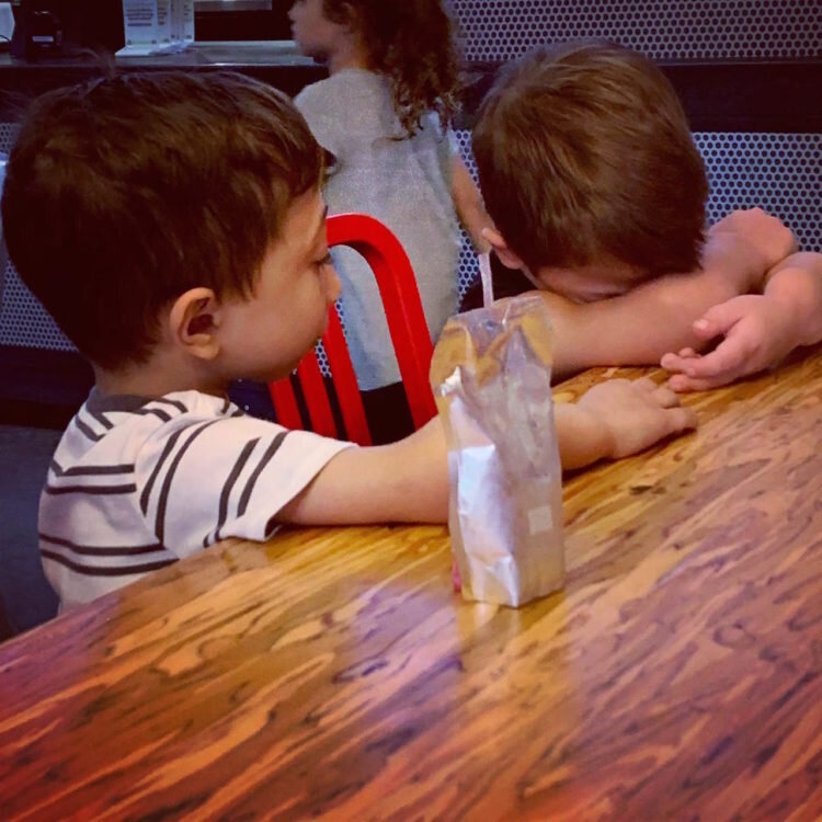 Jahan comforting his friend, Cade