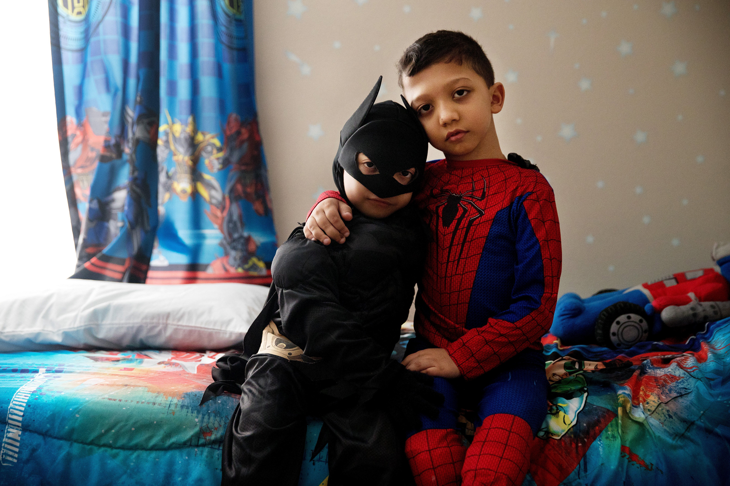 Jahan Adam, 6, left, and Arshaan Adam, 8, pose for a portrait in their favorite superhero costumes. The brothers have an extremely rare disease called Jansen's metaphyseal chondrodysplasia, which affects the bones and is caused by a genetic mutation. Though not terminal, the diagnosis means chronic pain and multiple surgeries to straighten weak bones. The disease also can lead to kidney problems, caused by the high levels of calcium in the bloodstream