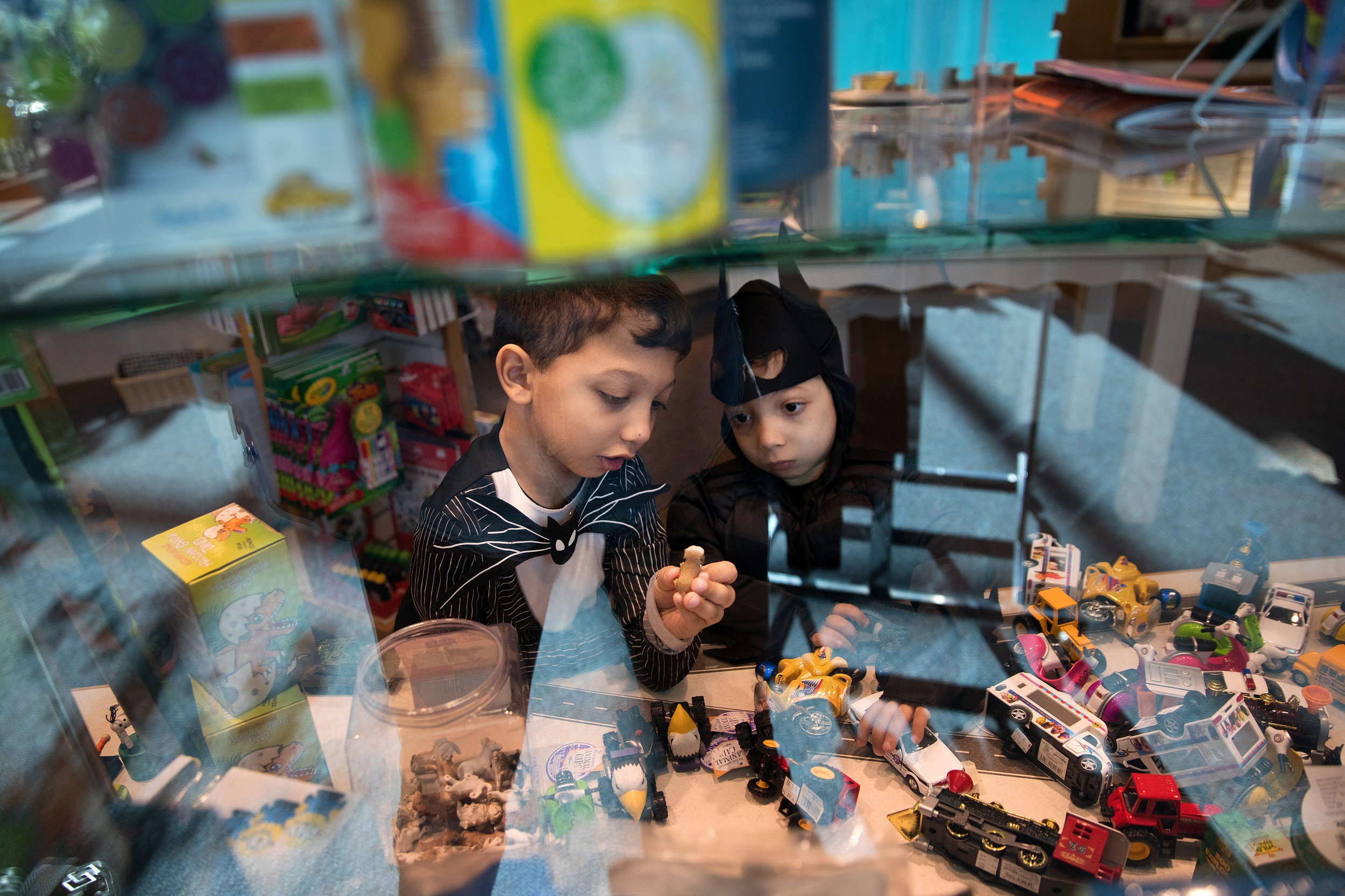 Arshaan, left, and Jahan explore the gift shop at Children's Hospital & Medical Center.